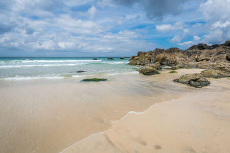 Tidal waves approaching the beach in St. Ives, Cornwall, England, UKの写真素材