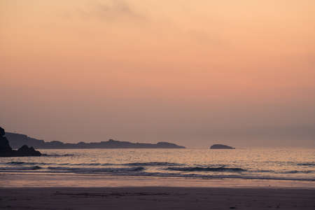 Waves hitting premier golden Porthmeor beach at dusk, Cornwall, England, UK, Europeの写真素材