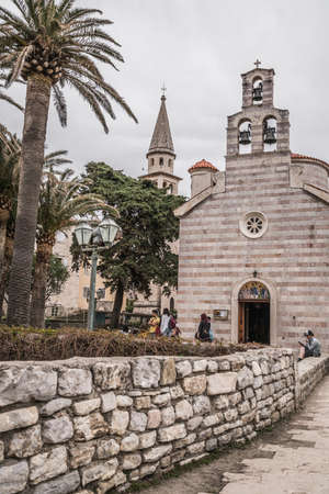 Budva, Montenegro - April 2018 : Courtyard and the three bells tower of the Church of Holy Trinityのeditorial素材