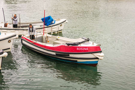 Marazion, England -  May 2018 : Tourist boats waiting to take on and transport passengers from St...