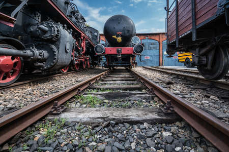 Jaworzyna Slaska, Poland - August 2018 : Man with a child looking at the old disused retro train...
