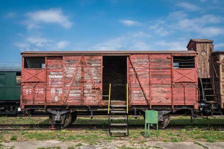 Jaworzyna Slaska, Poland - August 2018 : Small ladder to the entrance of the old wooden train carriage on the side track in the Museum of Industry and Railway in Silesiaのeditorial素材