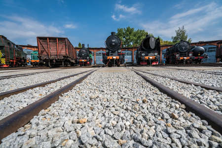 Jaworzyna Slaska, Poland - August 2018 : Old disused retro train locomotives and carriages on the side tracks in the depot in the Museum of Industry and Railway in Silesiaのeditorial素材