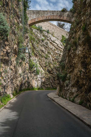 Arched bridge over the narrow one lane road near Dubrovnik Old town fort, Croatiaの写真素材