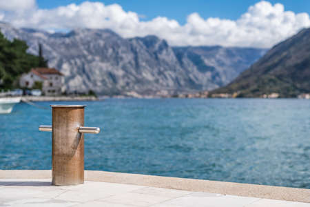 Steel anchoring bollard on the shore in the beautiful Perast town in the Kotor Bay, Montenegro
