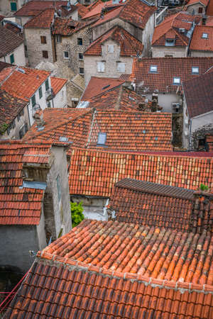 Aerial view of the red tiled houses roofs of Kotor Old town, Montenegroの写真素材