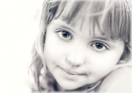 Black and white portrait of a cute little Caucasian toddler girlの写真素材