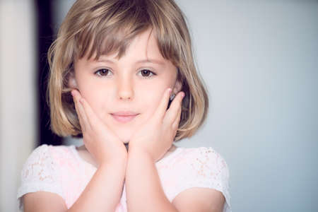 Portrait of a cute concerned Caucasian little girl