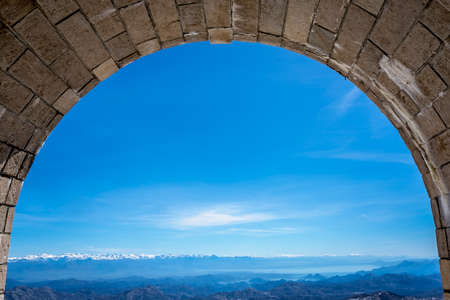 Stunning view of mountain winter landscape Lovcen National Park in Montenegro as seen from the tunnel leading to Njegos Mausoleumの写真素材