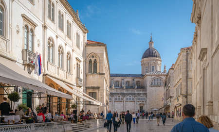 Dubrovnik, Croatia - April 2018 : Tourists walking, sightseeing or sitting in restaurants in the...