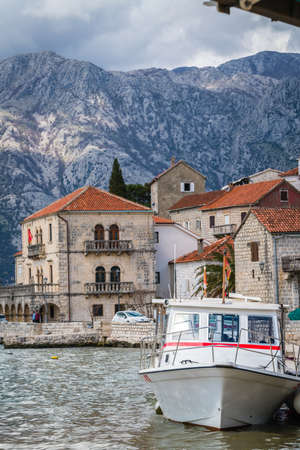 Perast, Montenegro - April 2018 : Small motor boat on the shore in the beautiful Perast town in the Kotor Bayのeditorial素材
