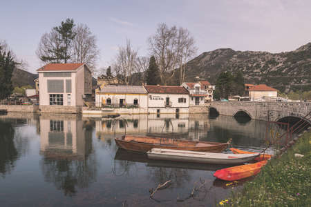 Virpazar, Montenegro - April 2018 : Neglected empty fisherman boats on the shore of lake Skadar in Virpazarのeditorial素材
