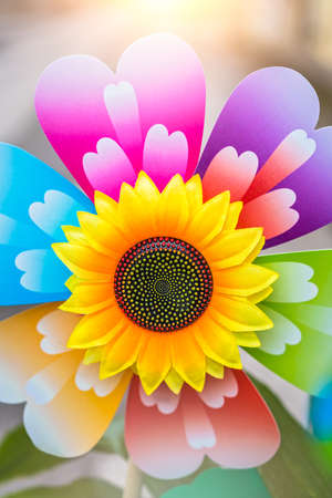 Large colorful artificial decorative sunflower fan on display for saleの写真素材