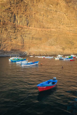 La Gomera, Spain - April 2013 : Small red and blue boat in La Gomera port, Canary Islandsのeditorial素材