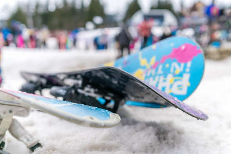 Szklarska Poreba, Poland - February 2019 : Colorful snowboards left in the snow on the mountain slope in winterのeditorial素材