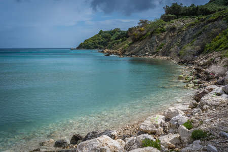 Stormy dramatic clouds accumulating over Alykes Beach in Zante Island, Greeceの写真素材