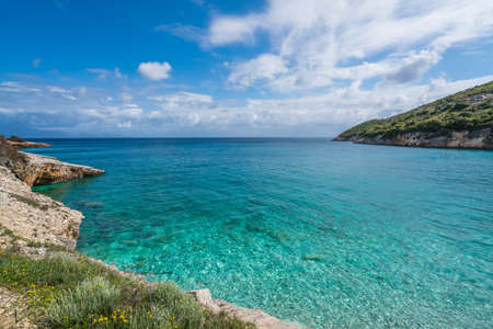 Amazing turquoise waters on the Xigia Sulfur Beach in summer on Zante Island, Greece