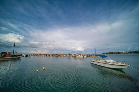 Zakynthos, Greece -  April 2019 : Wide angle view of the small private boats moored in port near Tsilivi beach in summer, Zante Islandのeditorial素材