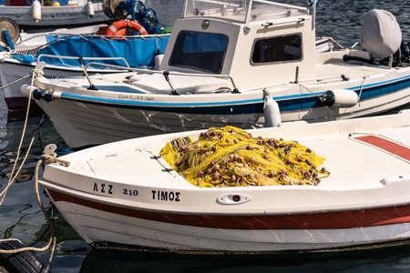 Zakynthos, Greece -  April 2019 : Small private fisherman boat moored in port near Keri beach in summer, Zante Islandのeditorial素材