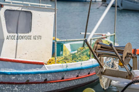 Zakynthos, Greece -  April 2019 : Close up of a fisherman boat moored in the Laganas port