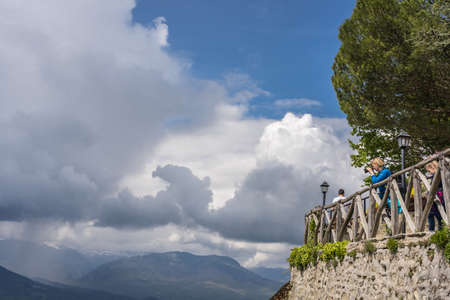 Meteora, Greece -  April 2019 : Female tourist on a lookout taking pictures of the landscape at Meteora, Trikala regionのeditorial素材