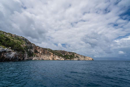 Coastline cliffs near Blue Caves as seen from a tourist boat, Zante Island, Greeceの写真素材