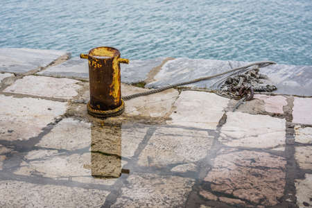 Steel anchoring bollard on the shore in the beautiful Zakynthos town, Greece