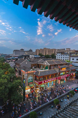 Xian, China -  July 2019 : Crowds walking among shops in the bustling streets of the Muslim Quarter in the evening as seen from the viewpoint in rum Tower, Xian city, Shaaxi Provinceのeditorial素材