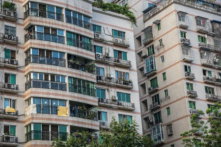 Chengdu, China -  July 2019 : Windows and balconies in high residential buildings and blocks of flatsのeditorial素材