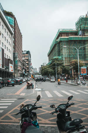 Xian, China -  July 2019 : Scooters parked on a street in the city of Xian in summer, Shaanxi Provinceのeditorial素材
