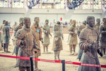 Xian, China -  July 2019 : Standing clay soldiers forming part of an army of terracota warriors, created during the reign of first chinese emperor Qin Shi Huang Di, Xian, Shaanxi Provinceのeditorial素材