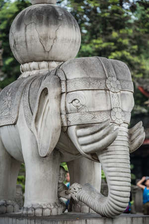 Chengdu, China -  July 2019 :  Large elephant sculpture figure in front of the landmark Thousand Buddha Pagoda in the courtyard of the Wenshu Monasteryのeditorial素材