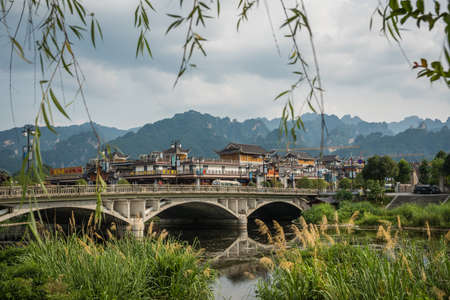 Wulingyuan, China - August 2019 : Wide arched bridge over Suoxiyu river in the ancient part of Wullingyuan town, Hunan Provinceのeditorial素材