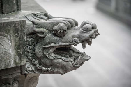 Lion head sculpture figure in the courtyard of the Wenshu Monastery, Chengdu, China
