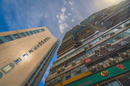 Chongqing, China -  August 2019 : Tall highrise residential buildings in the Jiefangbei district in...