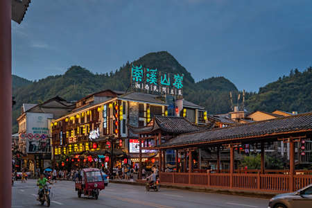 Wulingyuan, China -  August 2019 : Lights on buildings in the ancient part of Wulingyuan town at duskのeditorial素材