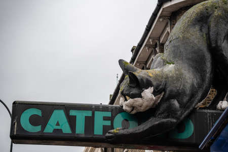 London, United Kingdom -  October 2019 : The giant fibreglass cat statue guarding the entrance to a shopping centre called the Catford Centre, Lewisham. It was designed, produced and installed in 1974 by one Owen Luder from a company called Embassy Signsのeditorial素材