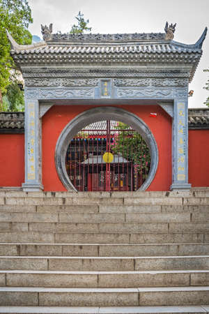 Huashan, China -  August 2019 : Wide stone concrete stairs leading to the entrance gate of the Buddhist temple at the foot of Huashan mountain, Xian, Shaanxi Provinceのeditorial素材