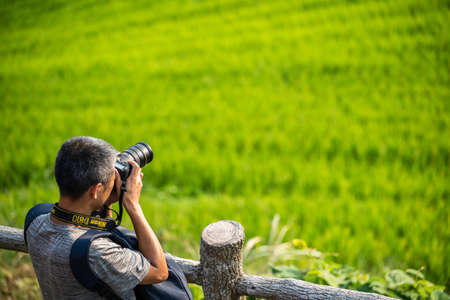 Pingan, China -  August 2019 : Professional photographer taking pictures of the Seven Stars...