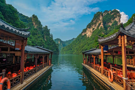 Wulingyuan, China -  August 2019 : Tourist boats waiting for passengers on the lakeshore of Baofeng Lake, Zhangjiajie National Forest Park, Hunan Province, China, Asiaのeditorial素材