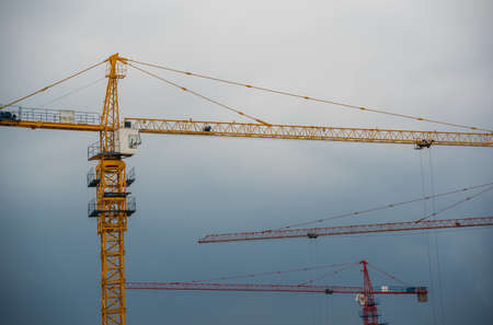 Zigong, China -  July 2019 : Tall cranes on a working construction building site, Sichuan Provinceのeditorial素材