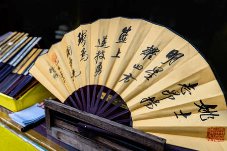 Guilin, China -  August 2019 : Paper fan on sale a hot day on the street insouvenir shop in town of Guilin town, Guangxi Provinceのeditorial素材