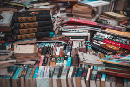 Chengdu, China -  July 2019 : Pile of second hand books for sale on a street marketのeditorial素材