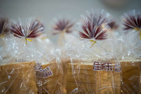 Zigong, China - July 2019 : Bread packed in plastic foil for sale in bakery in Zigong, Sichuan Provinceのeditorial素材