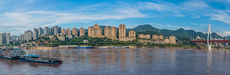 Chongqing, China - August 2019 : Panorama of Chongqing town on the bank of Yangtze river, the starting point for small boat trip cruises along this mighty riverのeditorial素材