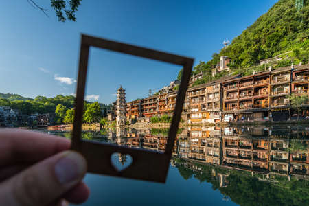 Feng Huang, China -  August 2019 : Framed landmark Fenghuang Wanming Pagoda Tower on the riverbank of Tuo river, Hunan Provinceのeditorial素材