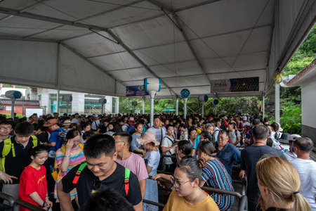 Zhangjiajie, China - August 2019 :  Massive tourist crowds in a extremely long queue to the Wellingyuan entrance of the Zhangjiajie National Park, Hunan Provinceのeditorial素材