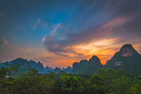 Beautiful impressive karst mountain landscape in Yangshuo at dusk, Guangxi Province, Chinaの写真素材