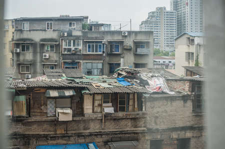 Yichang, China - August 2019 : View of the tin roof of homes in Yichang poor suburb, Hubei Provinceのeditorial素材