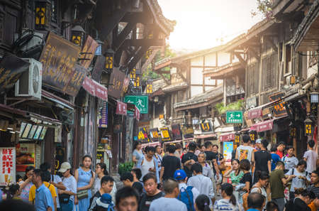 Chongqing, China -  August 2019 : Crowds visiting the popular shopping street in Ci Qi Kou Ancient townのeditorial素材